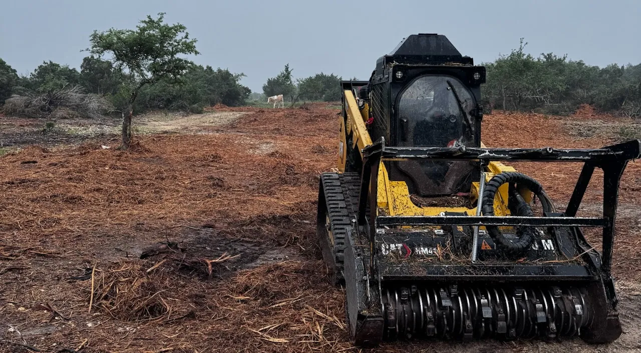 Caterpillar 299 D3 XE equipment used by Black Cat Land Management for land clearing in Central Texas